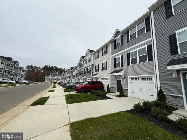 a view of multiple houses with a yard