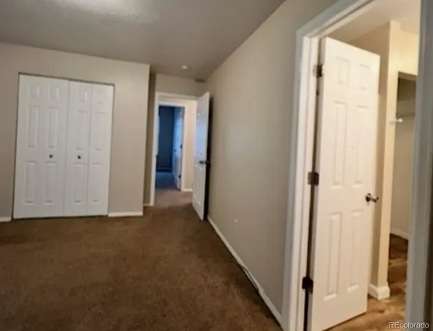 a kitchen with a sink and a refrigerator