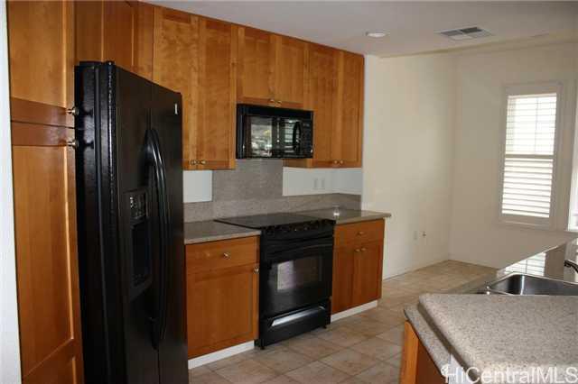 520 Lunalilo Home Road, Unit 7202 Honolulu, HI 96825 - Photo 1 of 1 a kitchen with stainless steel appliances granite countertop a refrigerator and a stove top oven