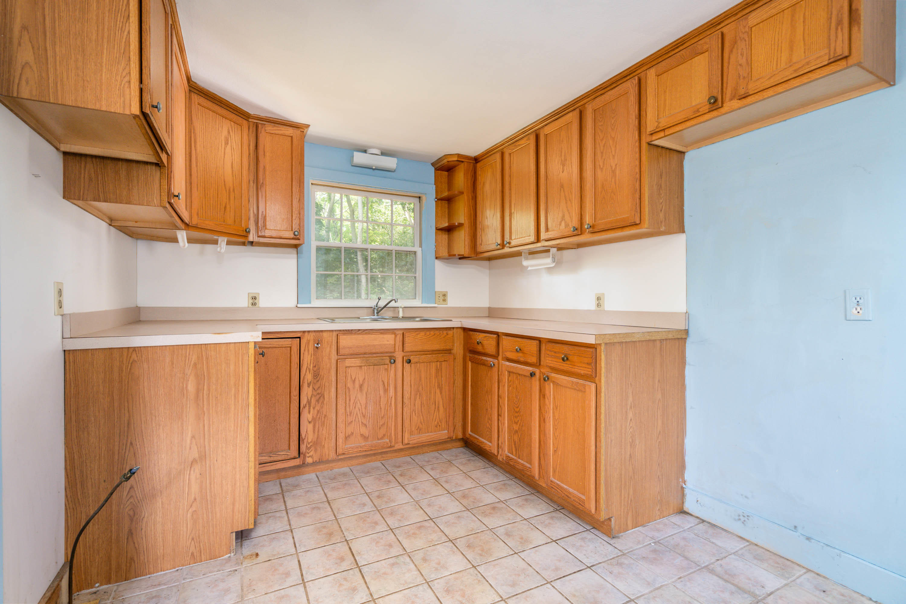 66 Pilgrim Spring Road Wellfleet, MA 02667 - Photo 9 of 21 a kitchen with stainless steel appliances granite countertop a sink and cabinets