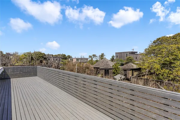a view of a balcony with an outdoor seating
