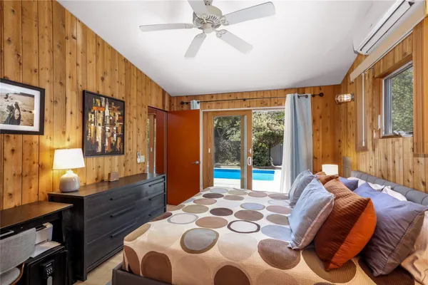 a bed room with a bed and a window