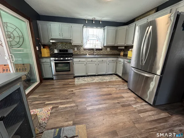 a living room with furniture and a rug
