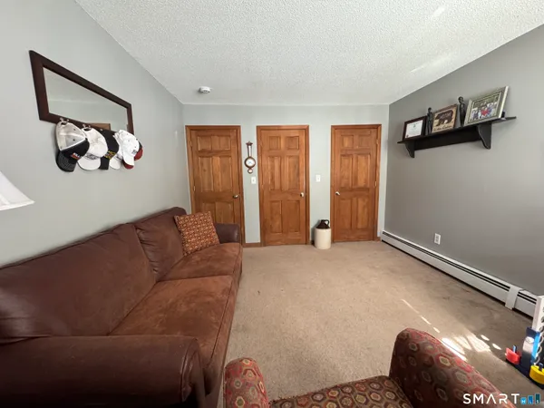 a bedroom with bed and window