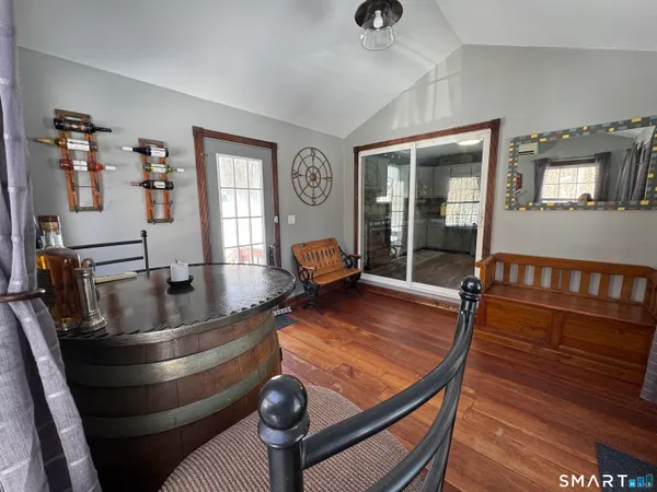 a view of a dining room with furniture and window