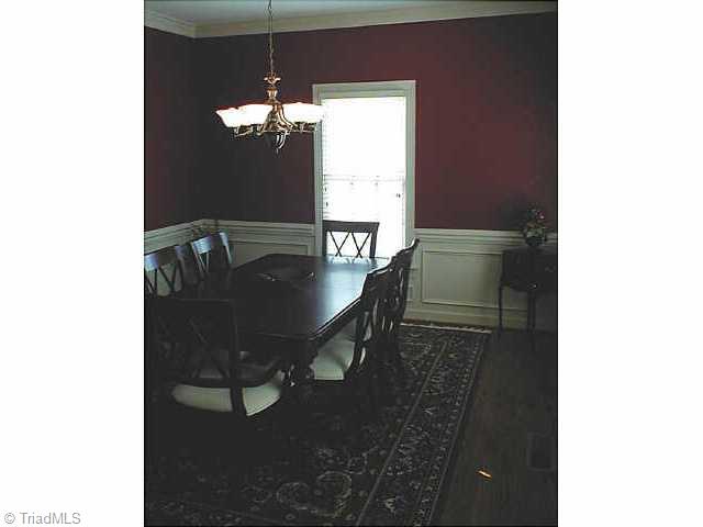 1609 Slane Road Clemmons, NC 27012 - Photo 5 of 9 Other. Formal dining room with wood floors & decorative moldings.
