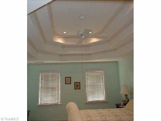 1609 Slane Road Clemmons, NC 27012 - Photo 9 of 9 Other. Huge master bedroom features walk-in closet plus elaborate multi-tiered tray ceiling.