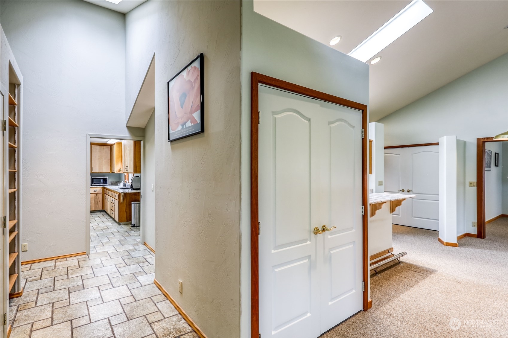 878 North Kendall Road Sequim, WA 98382 - Photo 12 of 30 a view of a hallway with wooden floor and a living room