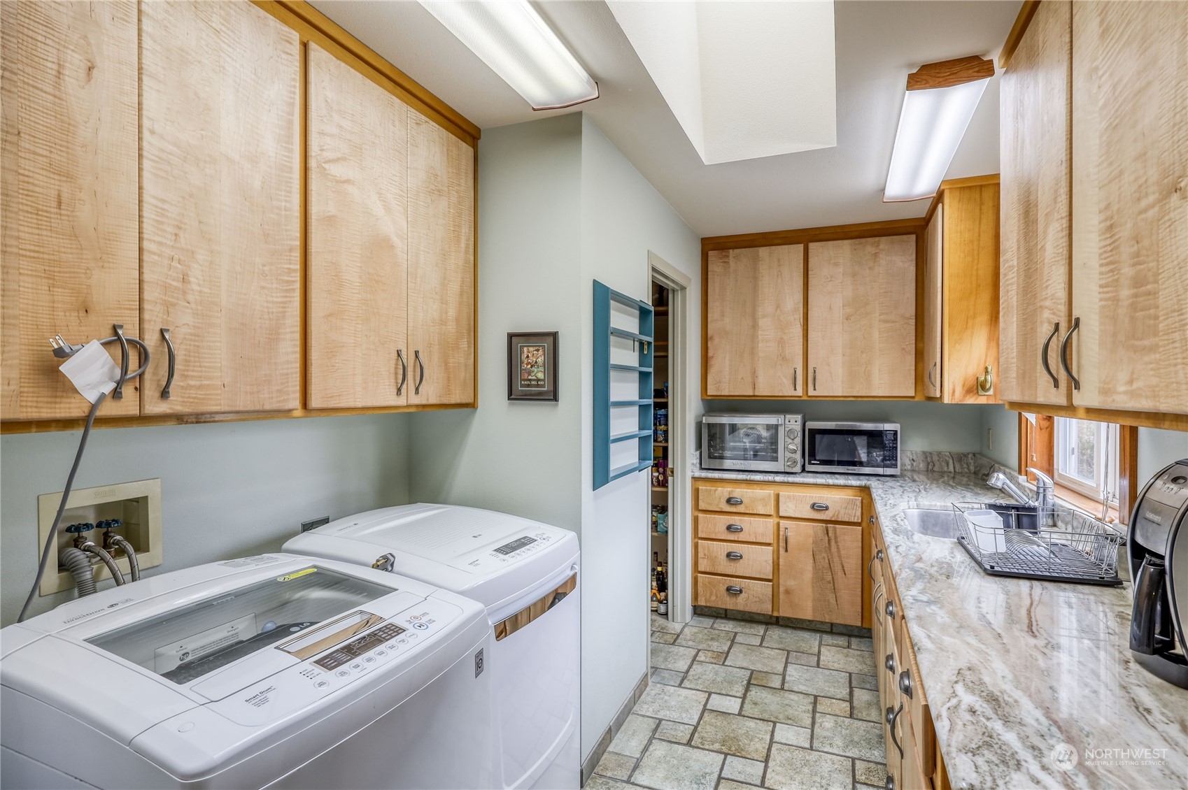 878 North Kendall Road Sequim, WA 98382 - Photo 16 of 30 a kitchen that has a sink and a stove in it