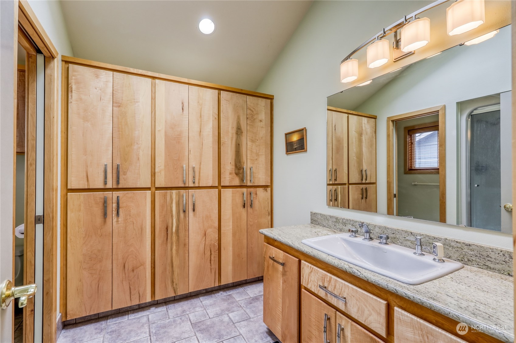878 North Kendall Road Sequim, WA 98382 - Photo 20 of 30 a bathroom with a granite countertop sink and a mirror