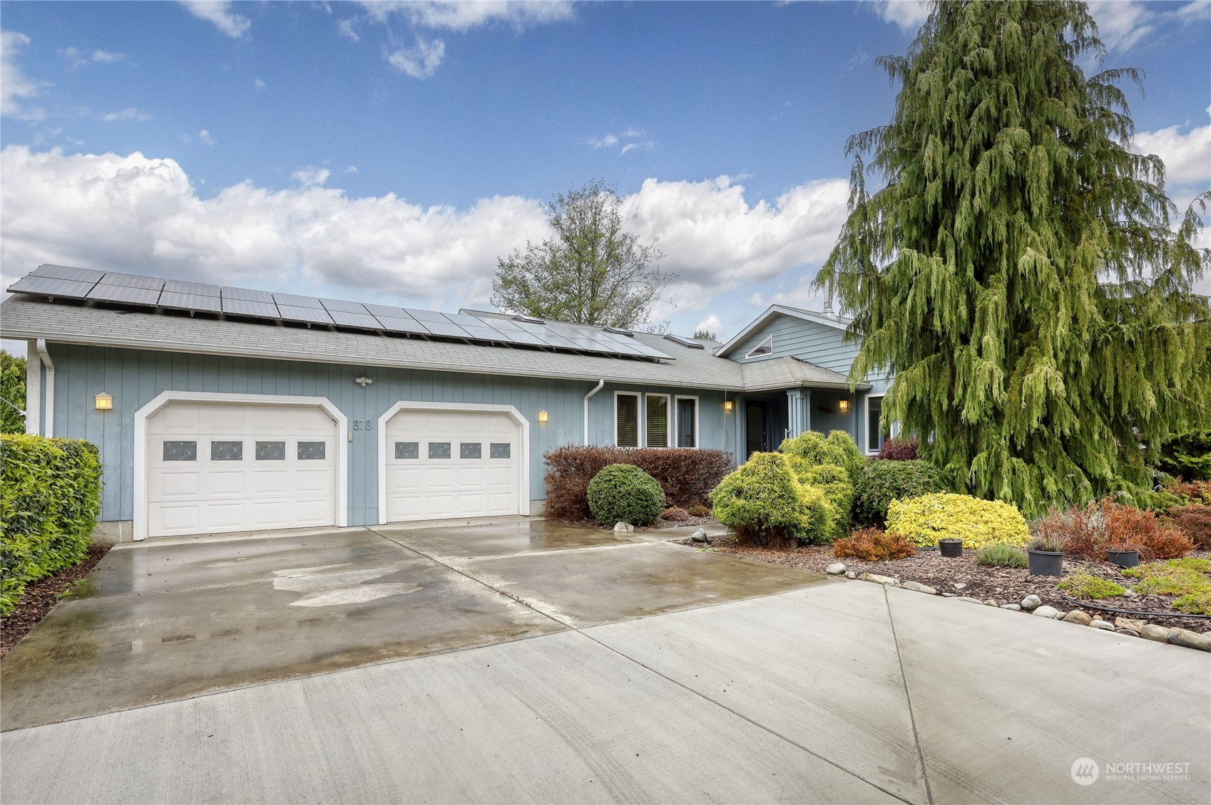 878 North Kendall Road Sequim, WA 98382 - Photo 2 of 30 a front view of a house with a yard and garage