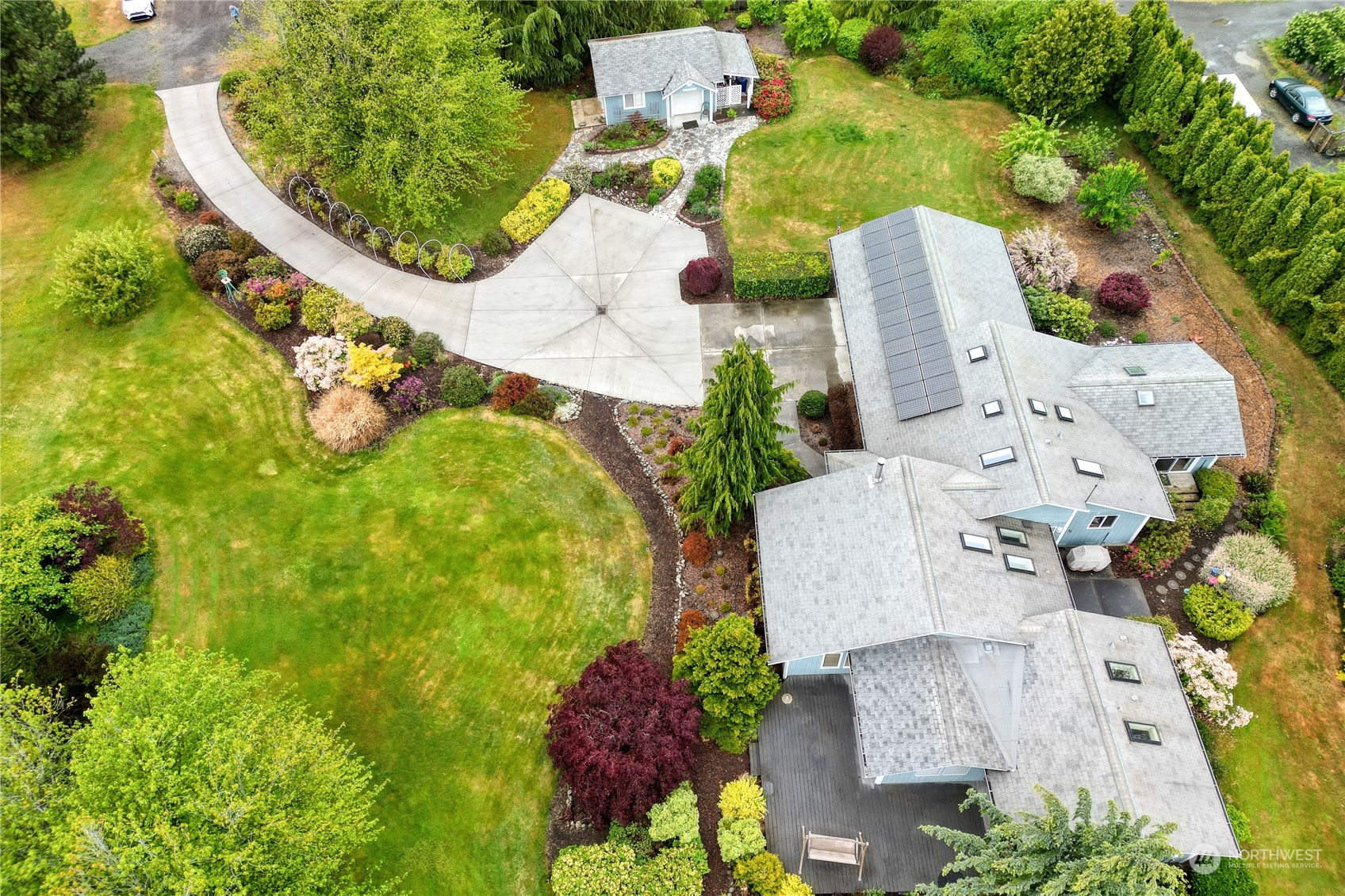 878 North Kendall Road Sequim, WA 98382 - Photo 30 of 30 an aerial view of a house with a swimming pool