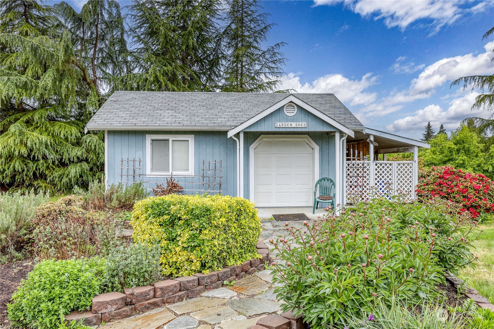 878 North Kendall Road Sequim, WA 98382 - Photo 5 of 30 a front view of a house with garden