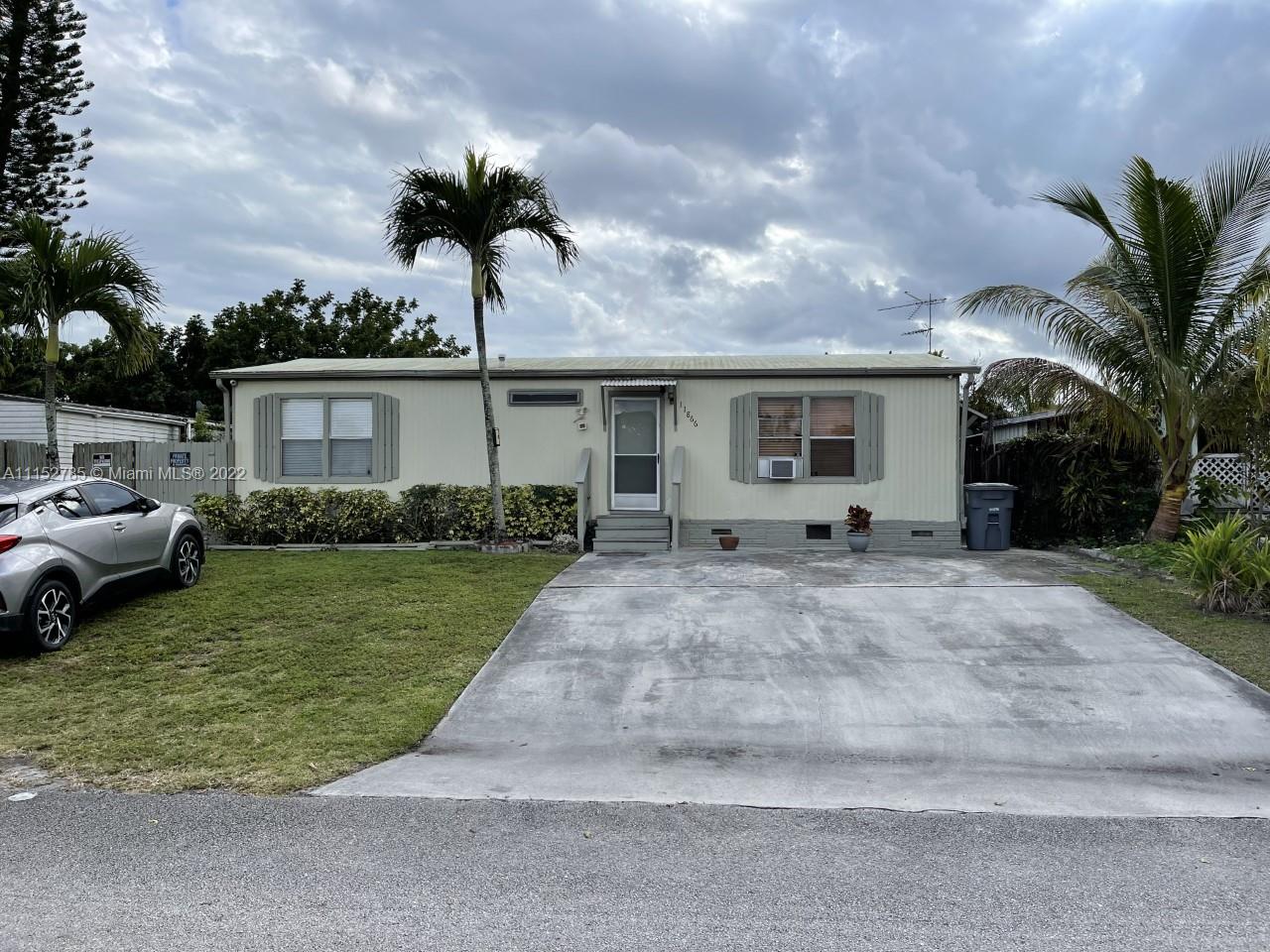 11866 North Branch Road Boca Raton, FL 33428 - Photo 1 of 6 a front view of a house with garden