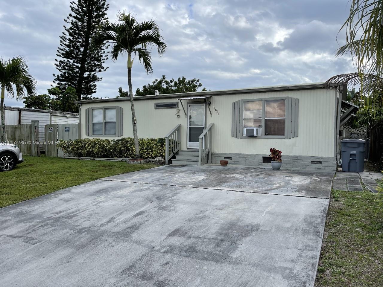 11866 North Branch Road Boca Raton, FL 33428 - Photo 2 of 6 a view of a house with backyard and entertaining space