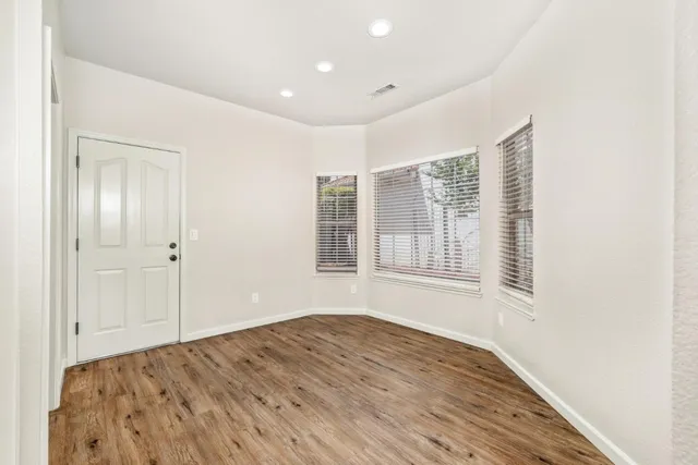 a view of a kitchen cabinets and wooden floor