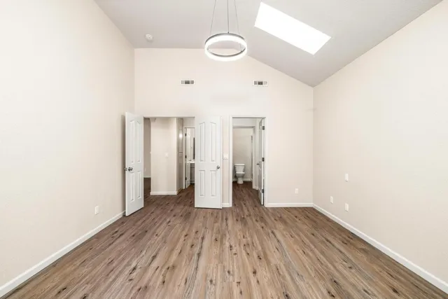 a spacious bathroom with a double vanity sink and a mirror