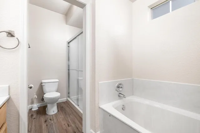 a view of entryway with stairs and wooden floor