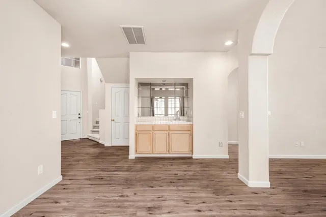 a kitchen with stainless steel appliances granite countertop a sink and cabinets