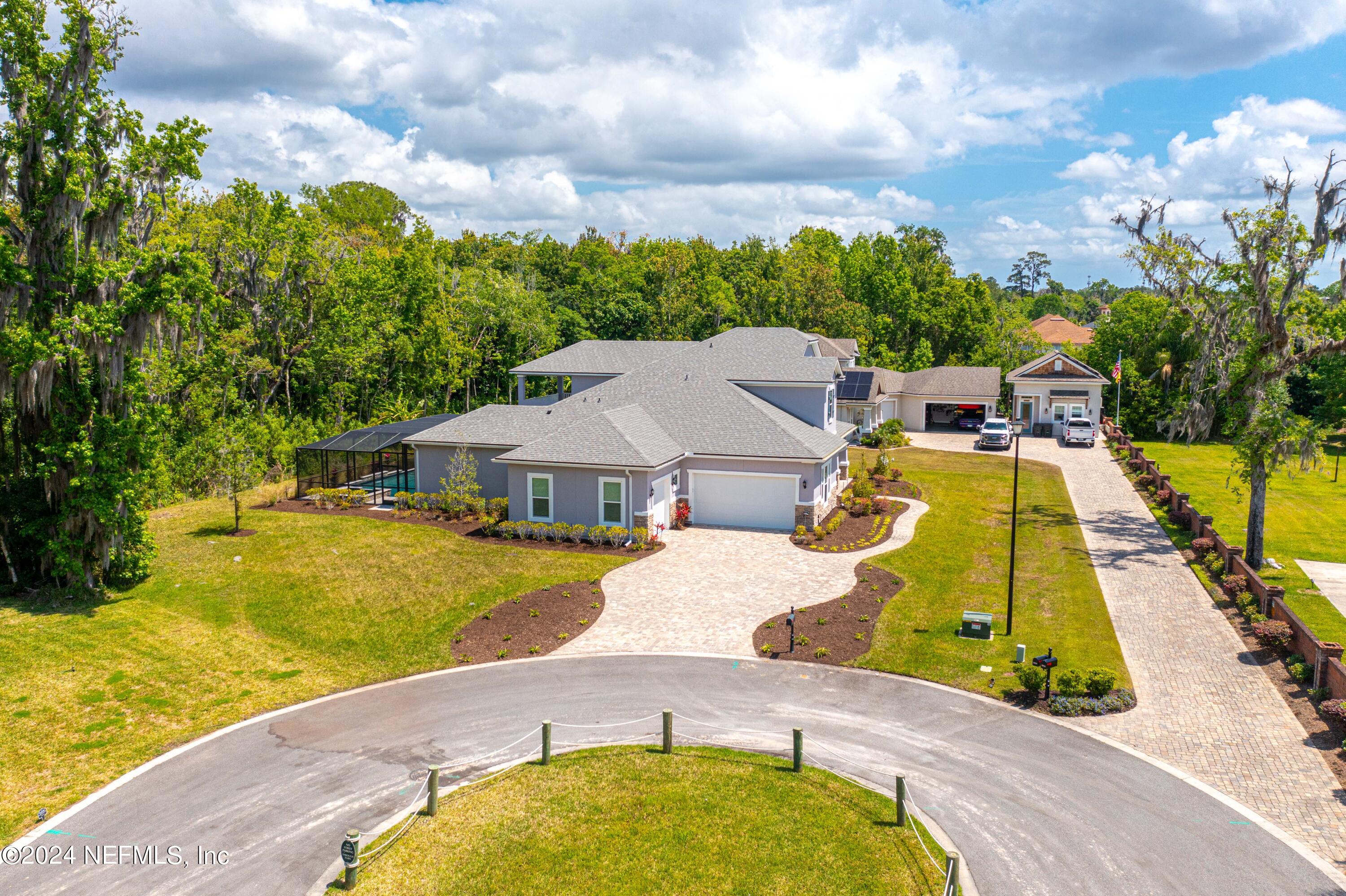 1924 Holmes Circle Fleming Island, FL 32003 - Photo 46 of 58 an aerial view of a house with swimming pool and trees around