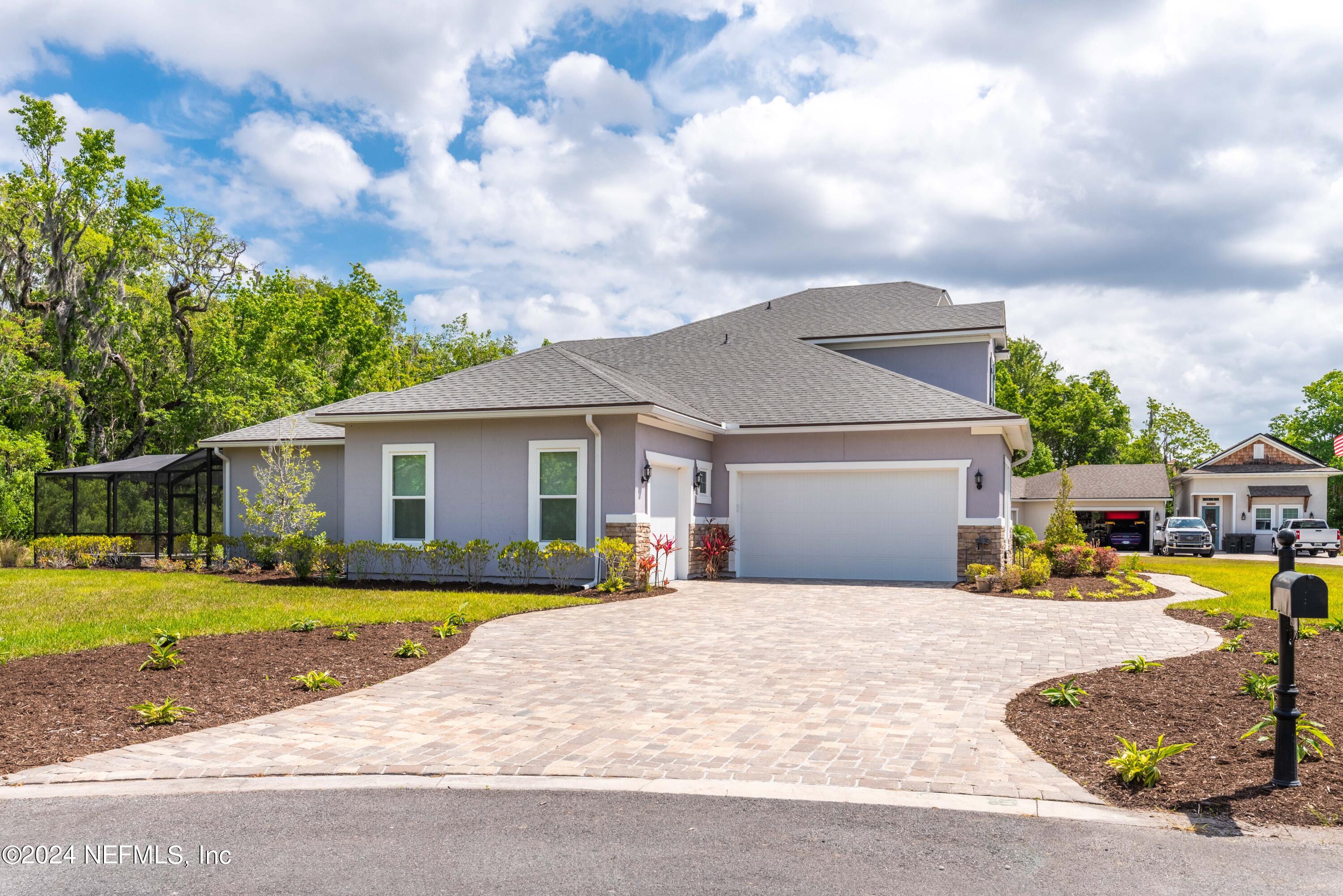 1924 Holmes Circle Fleming Island, FL 32003 - Photo 47 of 58 a view of a house with a patio