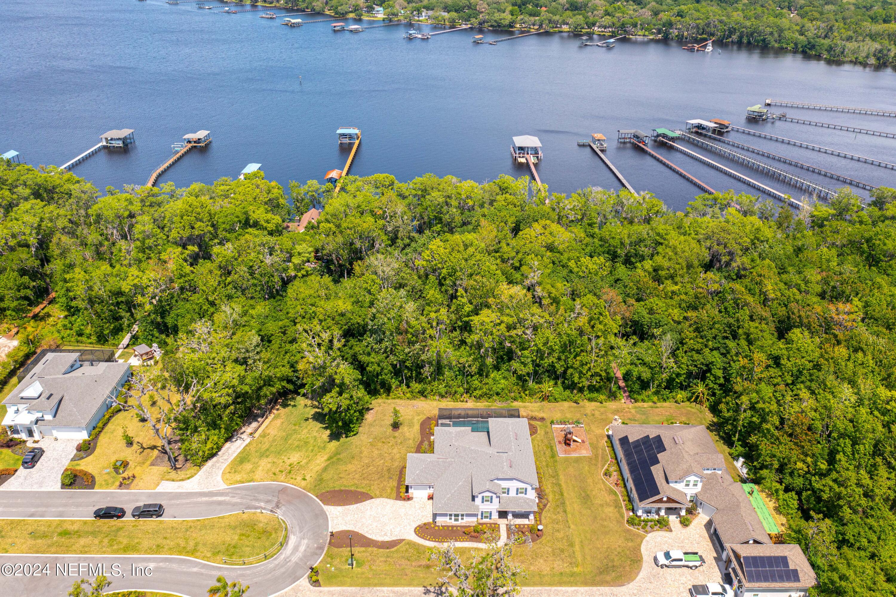 1924 Holmes Circle Fleming Island, FL 32003 - Photo 5 of 58 aerial view of a house with swimming pool and sitting area