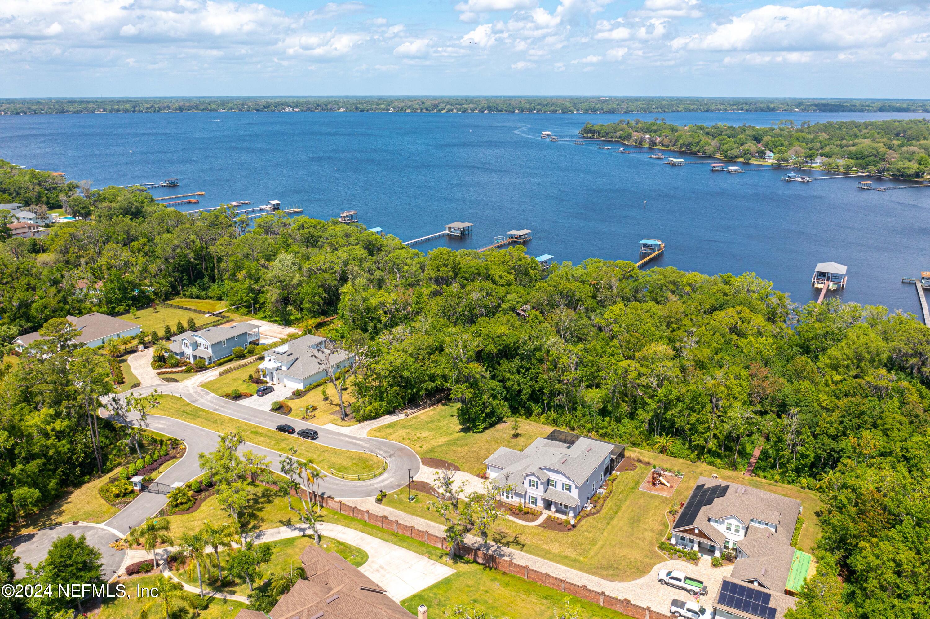 1924 Holmes Circle Fleming Island, FL 32003 - Photo 52 of 58 an aerial view of a house with a lake view