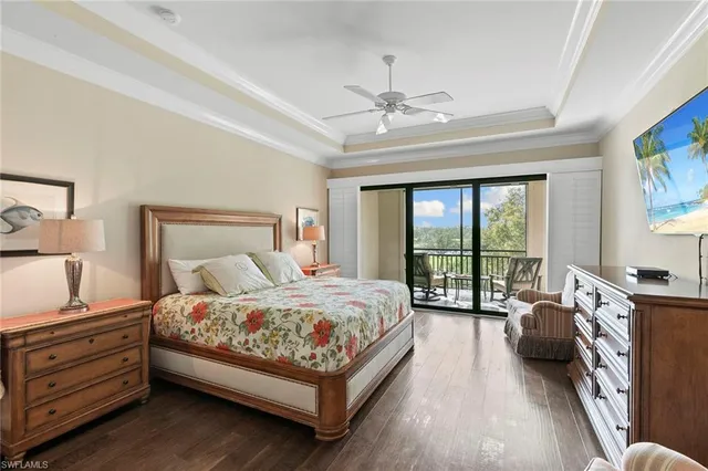 a bedroom with a bed couch and a window