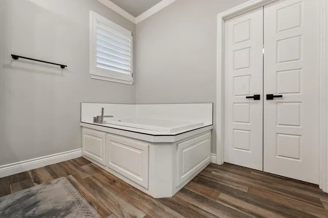 a bathroom with a double vanity sink and mirror