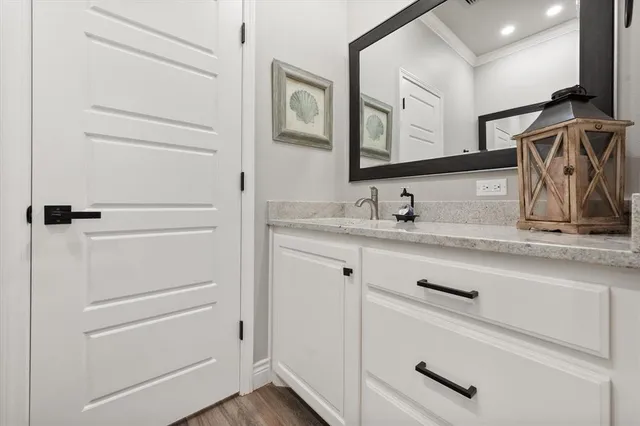 a spacious bedroom with a bed and a cabinets