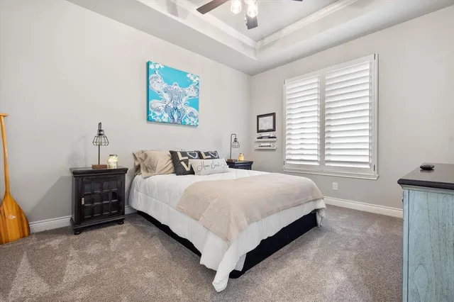 a kitchen with stainless steel appliances granite countertop a stove top oven a sink dishwasher a dining table and chairs with wooden floor