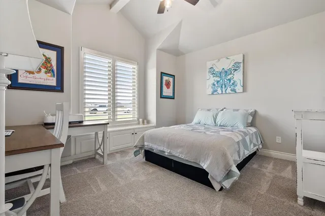 a kitchen with stainless steel appliances kitchen island granite countertop a stove a sink and white cabinets with wooden floor