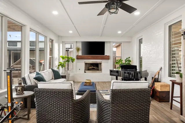 a living room with lots of furniture and white walls
