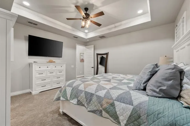 a bathroom with a granite countertop sink a toilet and a mirror