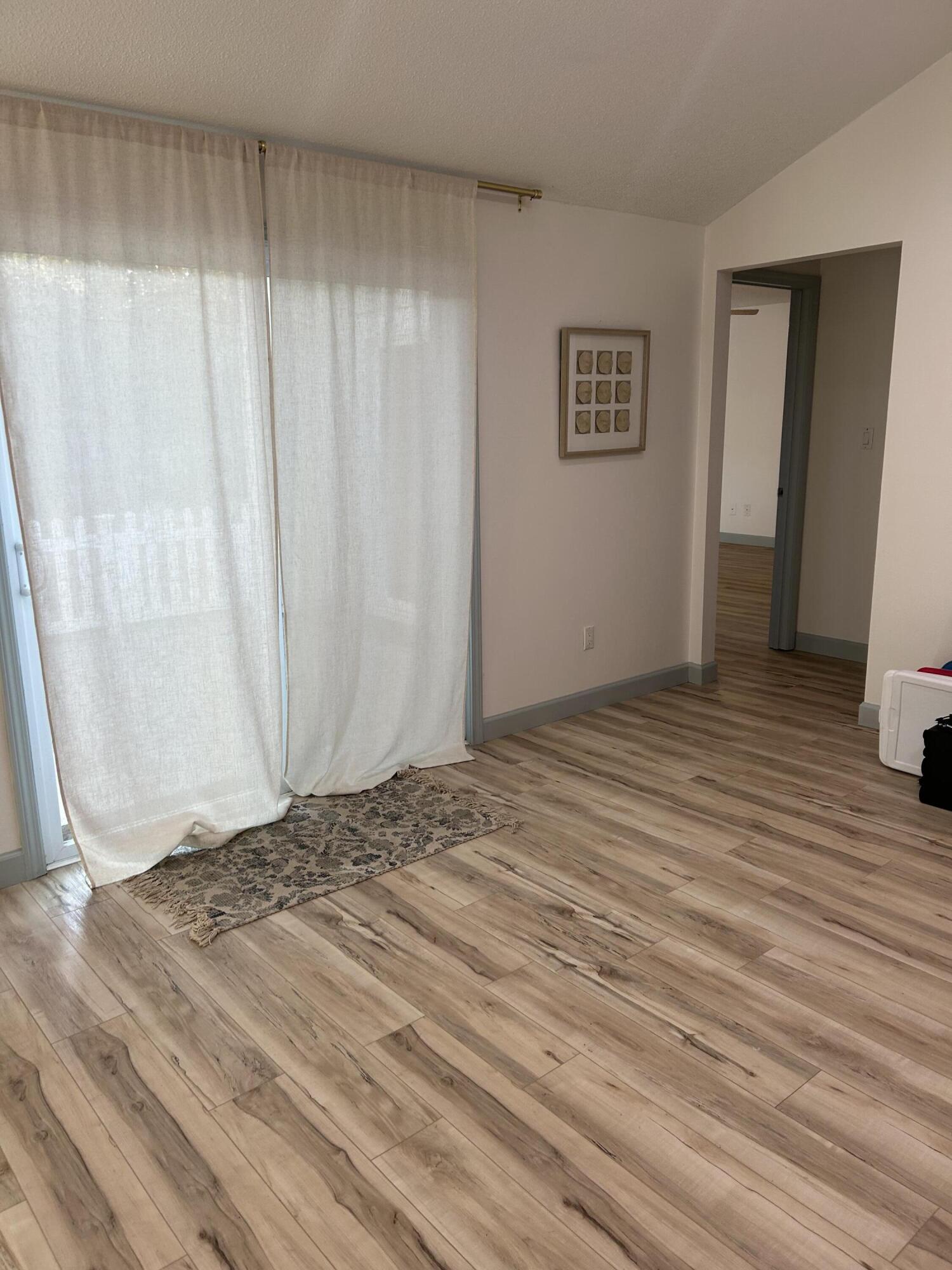 488 Linkside Place West Miramar Beach, FL 32550 - Photo 8 of 20 a view of empty room with wooden floor