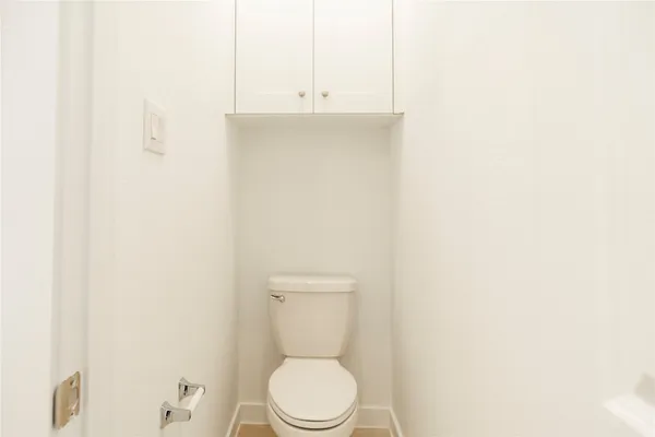 a bathroom with a sink a toilet and vanity