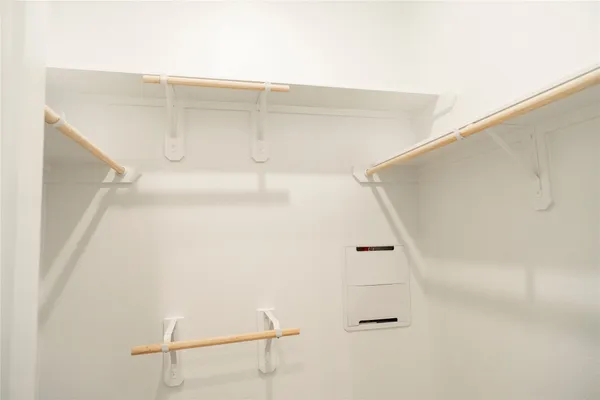 a view of an empty walk in closet