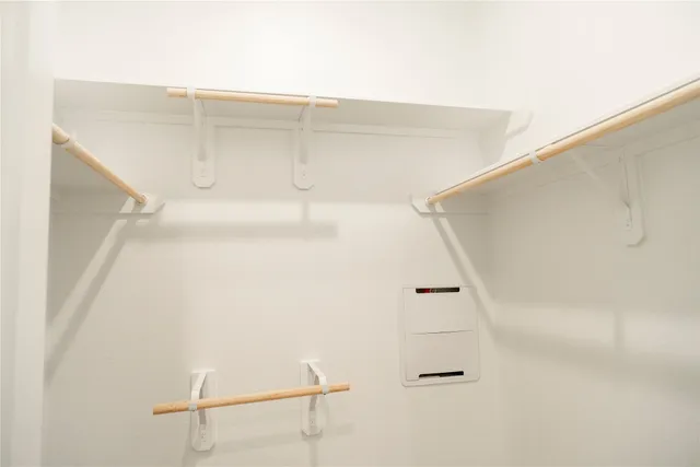 a view of an empty walk in closet