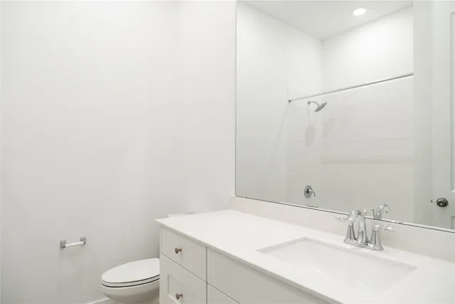 a bathroom with a double vanity sink and mirror