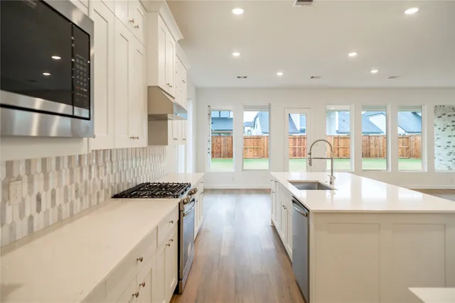a kitchen with counter top space and sink