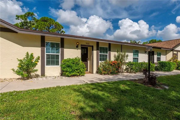 front view of a house with a yard