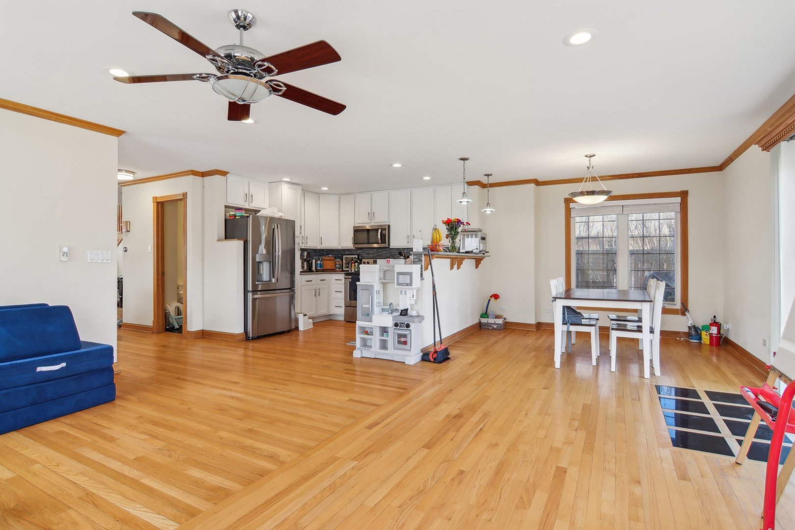 1115 Whitfield Road Northbrook, IL 60062 - Photo 11 of 54 a view of a livingroom with furniture a ceiling fan and windows