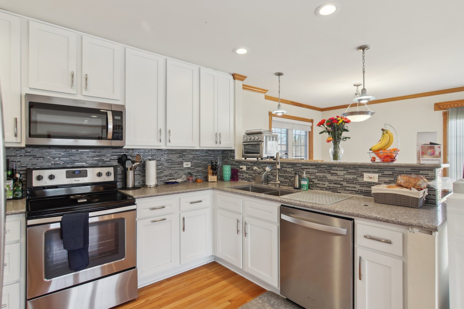 1115 Whitfield Road Northbrook, IL 60062 - Photo 13 of 54 a kitchen with stainless steel appliances granite countertop a stove a sink and a microwave
