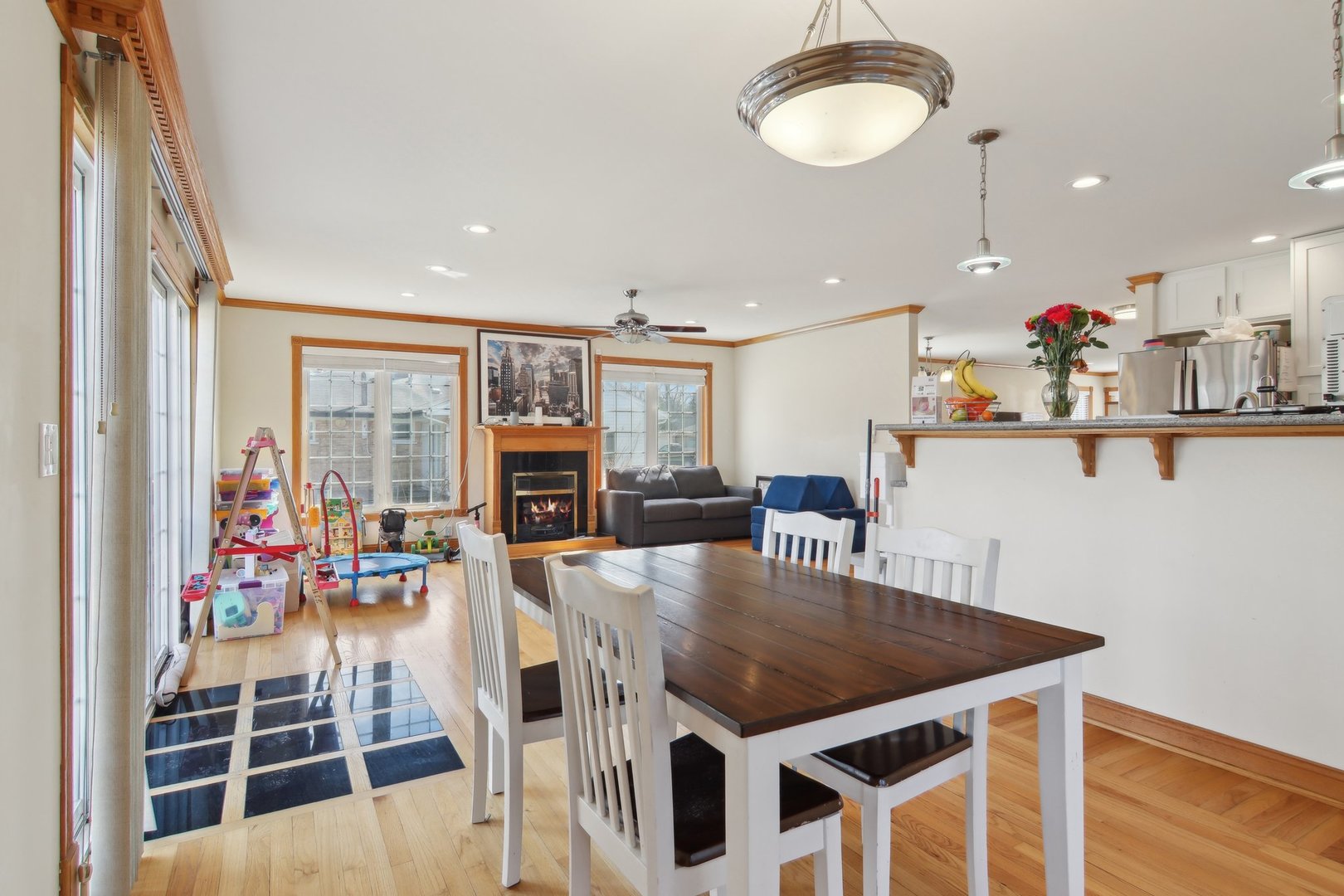 1115 Whitfield Road Northbrook, IL 60062 - Photo 16 of 54 a view of a dining room with furniture and wooden floor