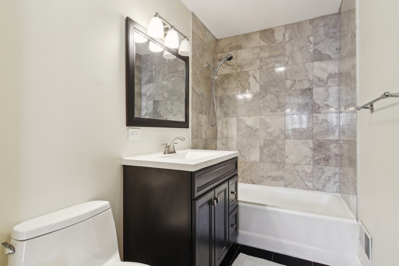 1115 Whitfield Road Northbrook, IL 60062 - Photo 17 of 54 a bathroom with a sink toilet and shower