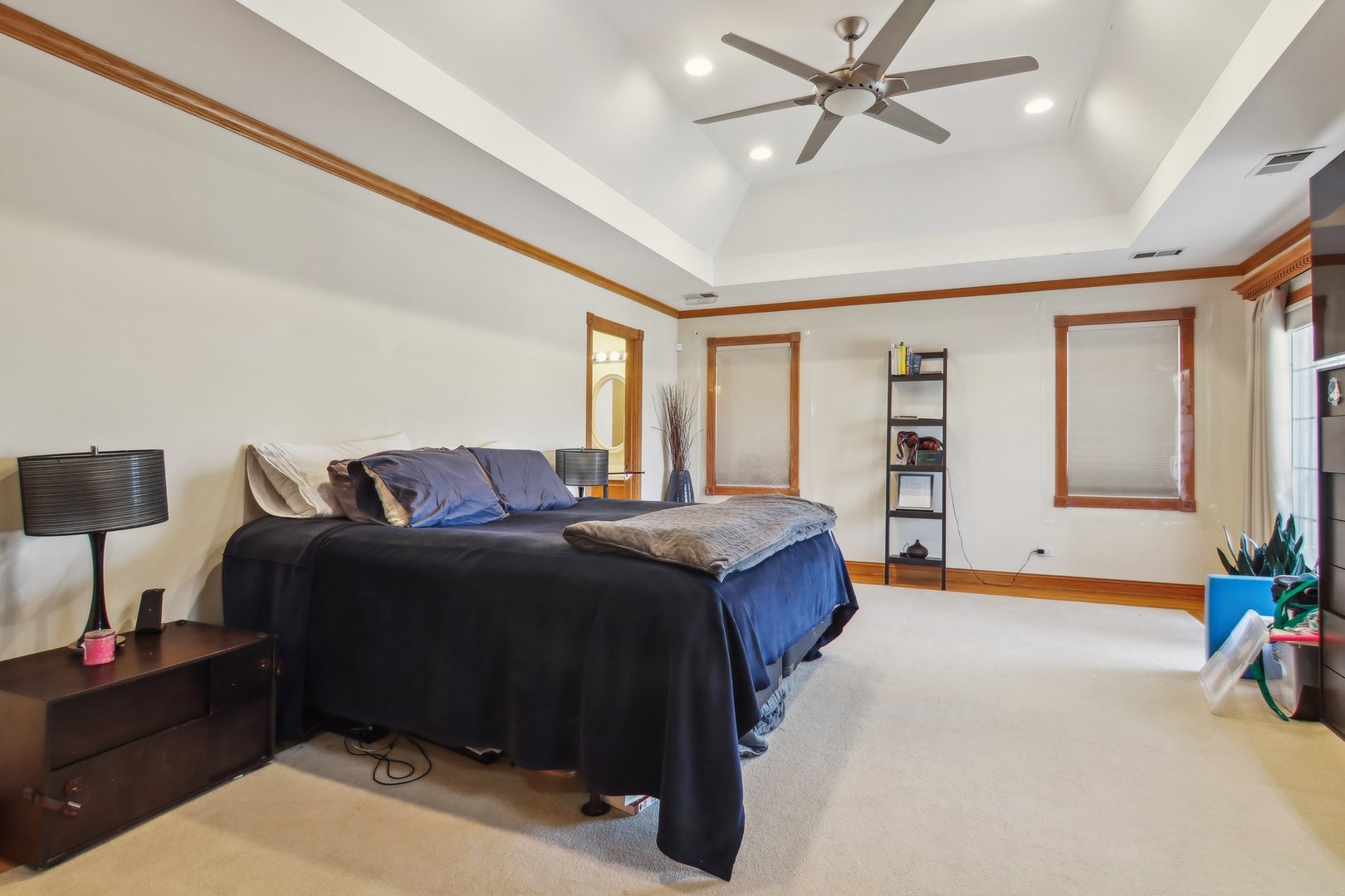 1115 Whitfield Road Northbrook, IL 60062 - Photo 22 of 54 a spacious bedroom with a bed and a chandelier