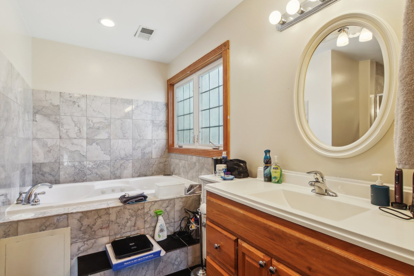1115 Whitfield Road Northbrook, IL 60062 - Photo 24 of 54 a bathroom with a sink double vanity and a mirror