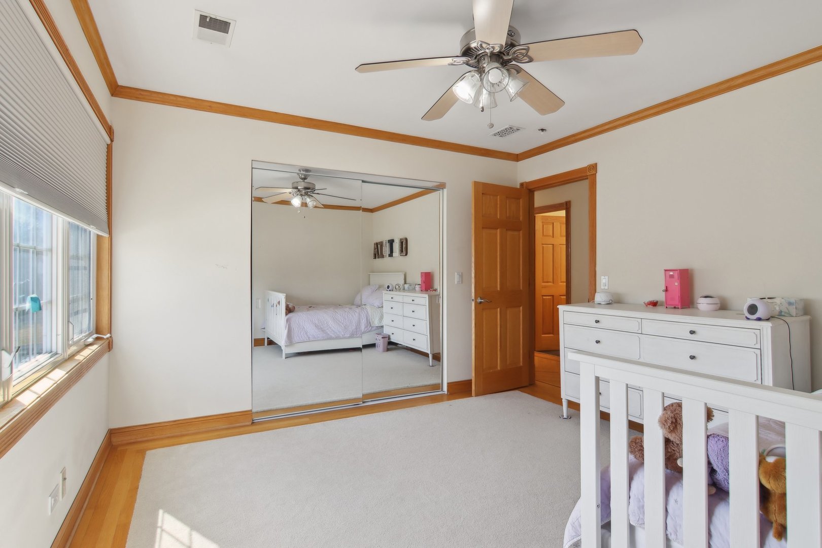 1115 Whitfield Road Northbrook, IL 60062 - Photo 29 of 54 a bedroom with a bed and a chandelier