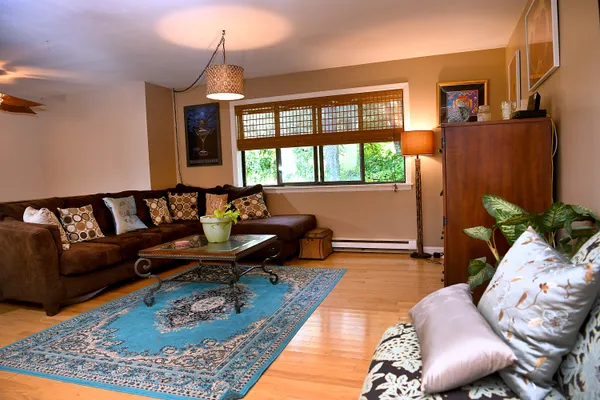 a living room with furniture and a large window