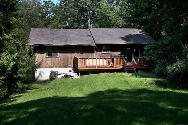 a aerial view of a table and chairs in backyard of house